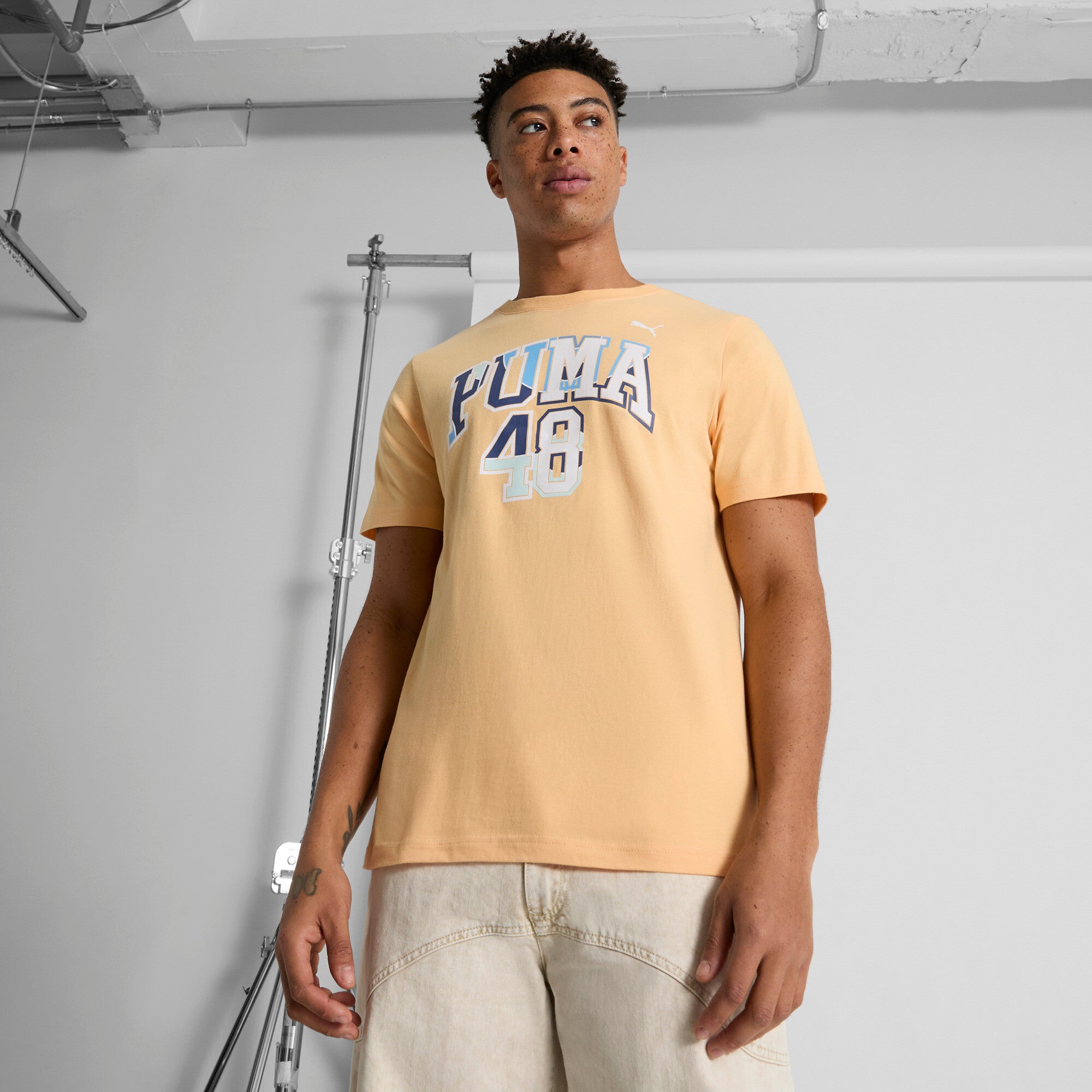 PUMA GRAPHICS Varsity Men's T-Shirt in Orange, Size S